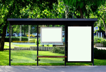bus shelter at a bus stop. blank white glass billboard and ad lightbox or sign panel. urban setting. green background. glass design. outdoor display. base for mockup. advertising concept
