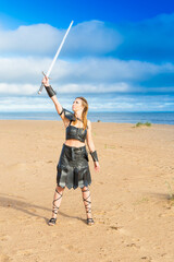medieval knight of knife cosplayer wearing leather plastron, skirt, bracelets and rerebrace with...