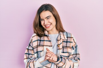 Fototapeta na wymiar Young caucasian girl wearing casual clothes with hands together and crossed fingers smiling relaxed and cheerful. success and optimistic