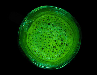 japanese matcha tea in a mug on a black background