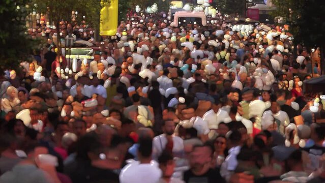 Crowded pedestrians walking on the big street time lapse. Unrecognisable people walking in Taksim Square. Blurred pedestrian walking fast. 