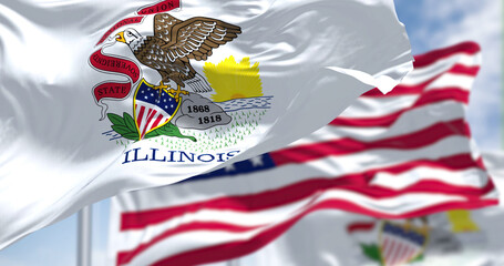 The Illinois state flag waving along with the national flag of the United States of America - obrazy, fototapety, plakaty