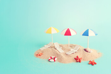 Fototapeta na wymiar holidays image of tropical sea and beach chairs under umbrellas. Summer travel and vacation concept