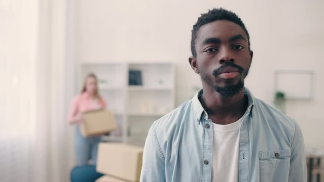 African American man feeling frustrated after break-up, girlfriend moving out