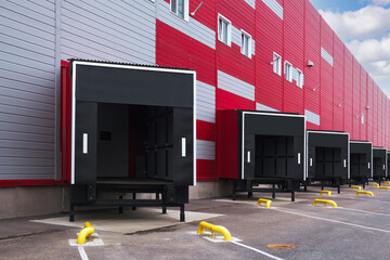 Entrance ramps of a large distribution warehouse with gates for loading goods, warehouse and...