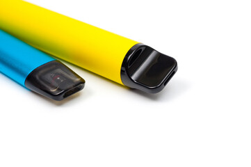 Two electronic cigarettes disposable and refillable with a replaceable cartridge in a blue and yellow body, photographed against a white background