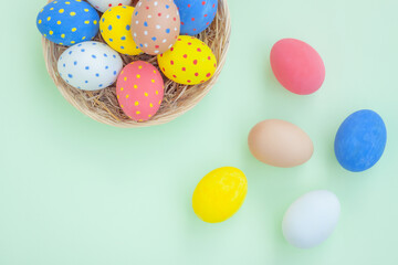 Colorful eggs on green background
