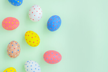 Colorful eggs on green background