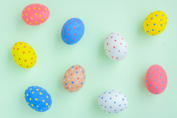Colorful eggs on green background