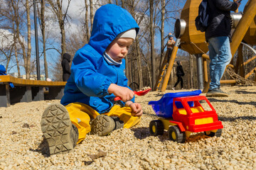 child playing on the sand
