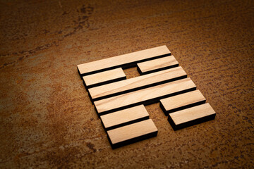 wooden Gene Key 56 i ging hexagram on rusty metal background human design