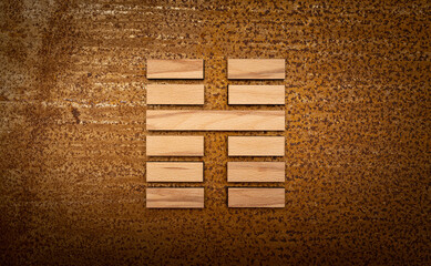 wooden Gene Key 16 i ging hexagram on rusty metal background human design