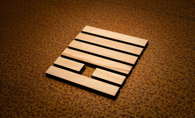 wooden Gene Key 13 i ging hexagram on rusty metal background human design