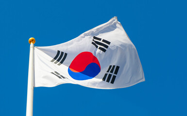 Flag of South Korea against blue sky background