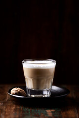 Coffee with milk on dark wooden background. Soft focus. Copy space.