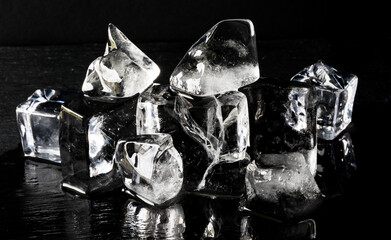 Composition of ice cubes against a black background.