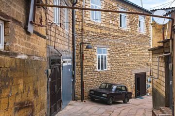 narrow street with old houses in the historical district of Derbent, Dagestan