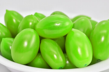 Porcelain dish with green cherry tomatoes