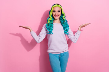 Photo of beautiful girl with emerald green hair compare two objects products isolated on pink color...