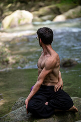 guy doing bareback yoga on the river