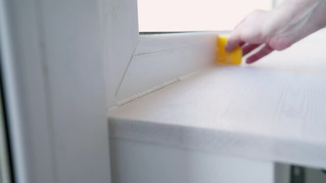 Smoothing Out Acrylic Sealant By Removing Excess With Sealant Smoother Tool