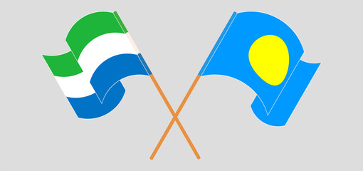 Crossed and waving flags of Sierra Leone and Palau