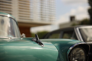 Classic Green Vintage Car with Chrome Details and Hood Ornament
