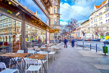 The modern outdoor cafe on the pavement in Big Ring Road of Budapest, Hungary