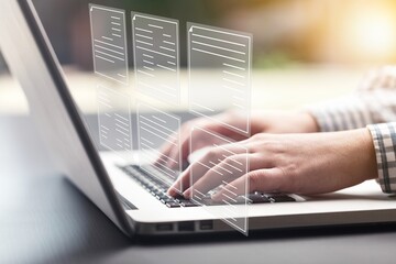 Hand using laptop computer with virtual screen and document, paperless quality assurance, management concept.