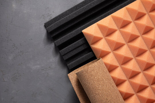 Acoustic foam and cork on concrete wall background. Sound isolation material for record studio