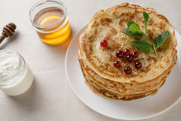 Big pancakes on the table, cooking delicious homemade pancakes