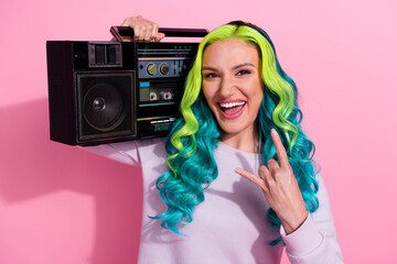 Portrait of careless positive girl hold boombox hand fingers demonstrate heavy metal symbol...