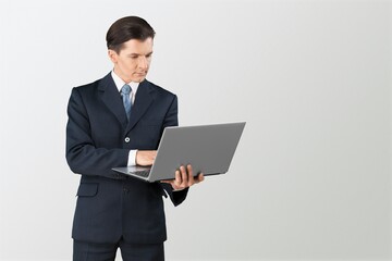 Successful young man student freelancer using laptop,