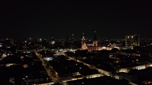 Drone Flies Towards Cathedral in Guadalajara, Mexico at Night