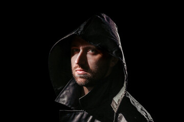 Angry man in a raincoat