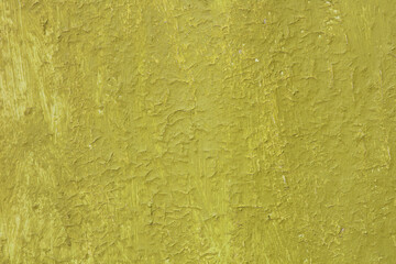 Beautiful vintage yellow background with old yellow paint with a rough surface, streaks and uneven texture of yellow paint on an old rough yellow surface