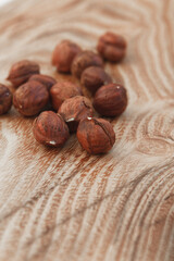 Hazelnuts on a wooden surface, rustic background