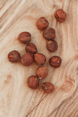 Hazelnuts on a wooden table, rustic background