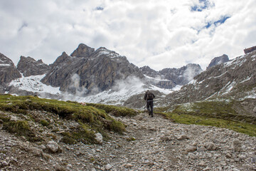 Fototapeta na wymiar man trekking in the mountains, Alps in Austria, Lienzer Dolomiten