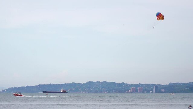 paragliding over the sea. High quality 4k footage