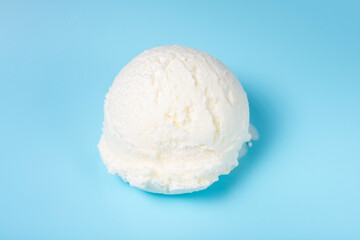 vanilla scoop of sundae ice cream isolated on blue background, close up