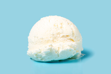 vanilla scoop of sundae ice cream isolated on blue background, close up