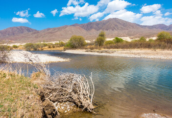 River among the mountains. Calm transparent ovda. Summer landscape. Boom Gorge, Kyrgyzstan.