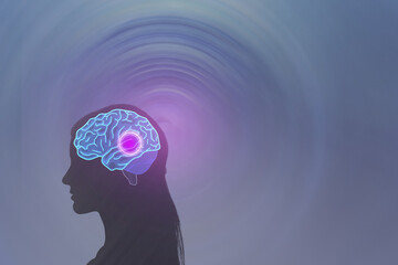Deep brain stimulation. Human head silhouette with glowing brain. DBS