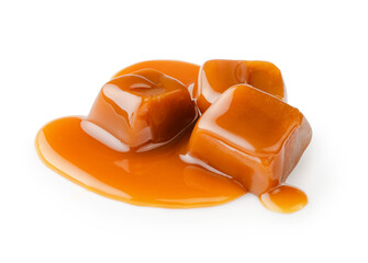 Caramel cubes with caramel sauce isolated on white background.