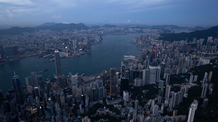 Obraz premium Central business zone with Victoria Harbour in drone point of view at night
