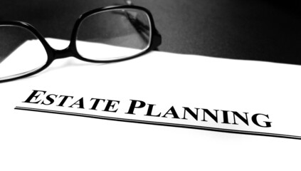 Estate Planning Documents on Desk with Glasses