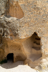Carved room and steps in Pasabag Monks Valley, Cappadocia, Turkey. Close up of fairy chimneys.