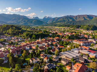 Aerial: Photo of Beautiful Old Town Surrounded By Lush Green Mountain Landscape At Kamnik, Slovenia