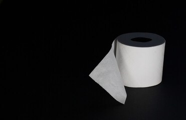 Toilet paper photographed on black background